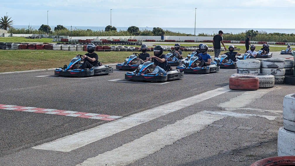 xelerate.tech colleagues lined up on go-karts at a karting track