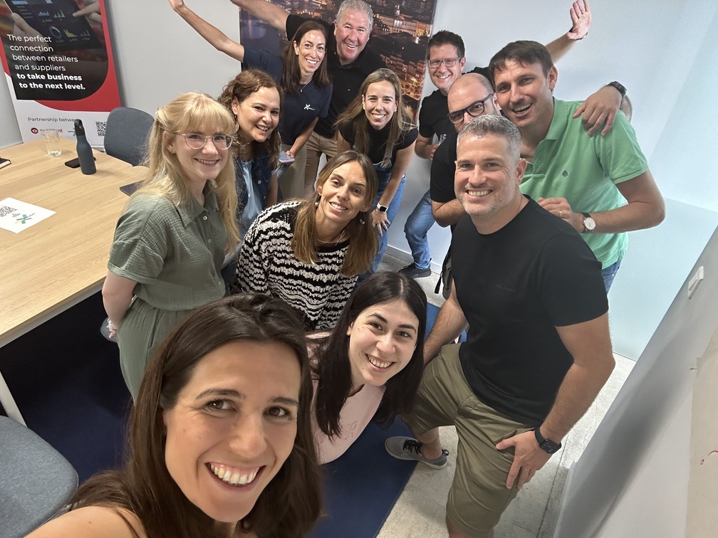 The xelerate.tech team taking a group selfie in a meeting room