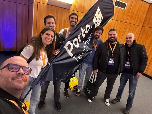 xelerate.tech team with the Porto Tech Hub banner at a tech event